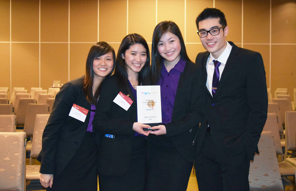 4-students-holding-up-a- certificate