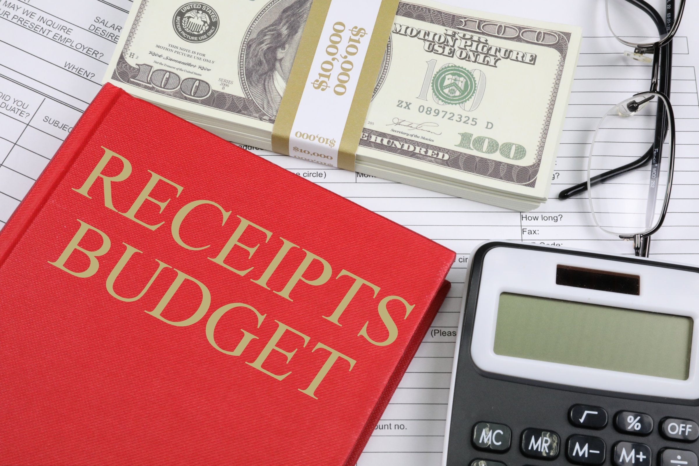 Budget book-money-calculator-on-desk